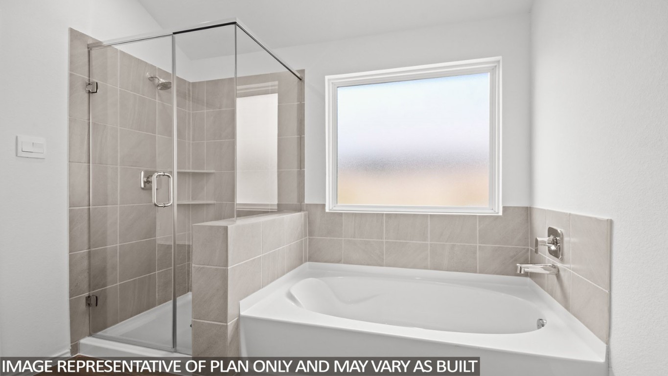 4408 Ledge Court Conroe, TX 77303 - Photo 10 of 26 a bath tub sitting next to a shower