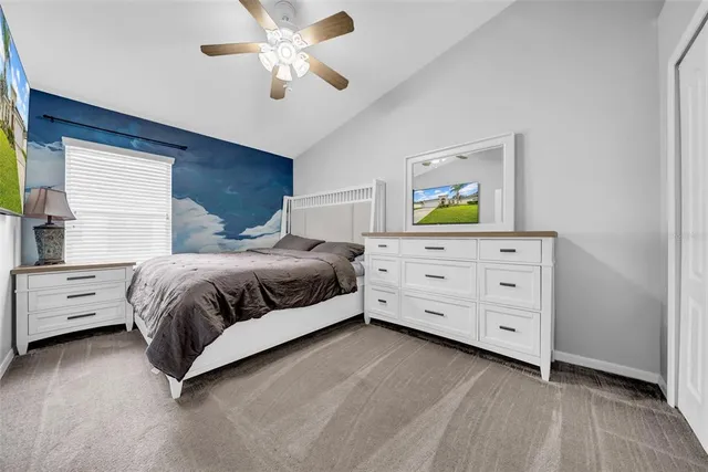 a bedroom with a bed and a dresser