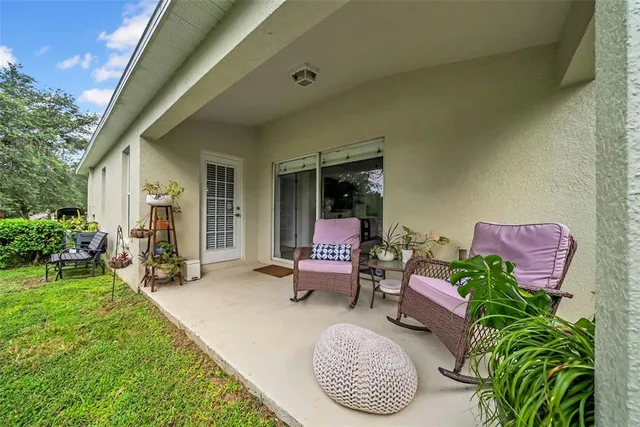 a house view with outdoor space and garden