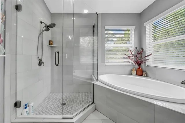 a bathroom with a shower and a sink