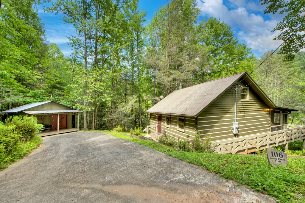 106 Butler Creek Road Cherry Log, GA 30522 - Photo 11 of 58 a view of a house with a yard and plants