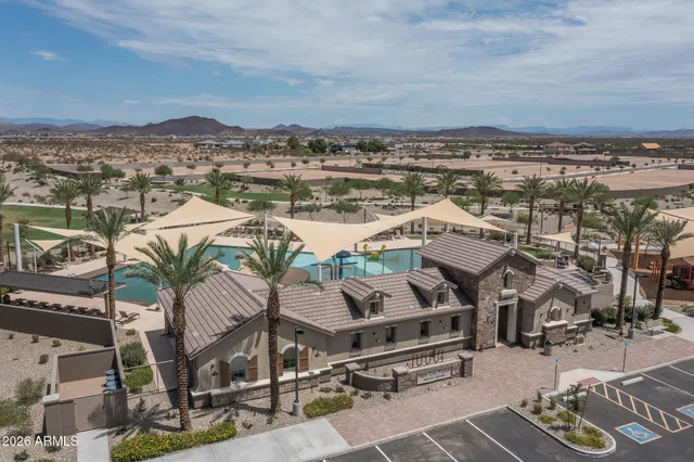 a view of a terrace with lawn chairs
