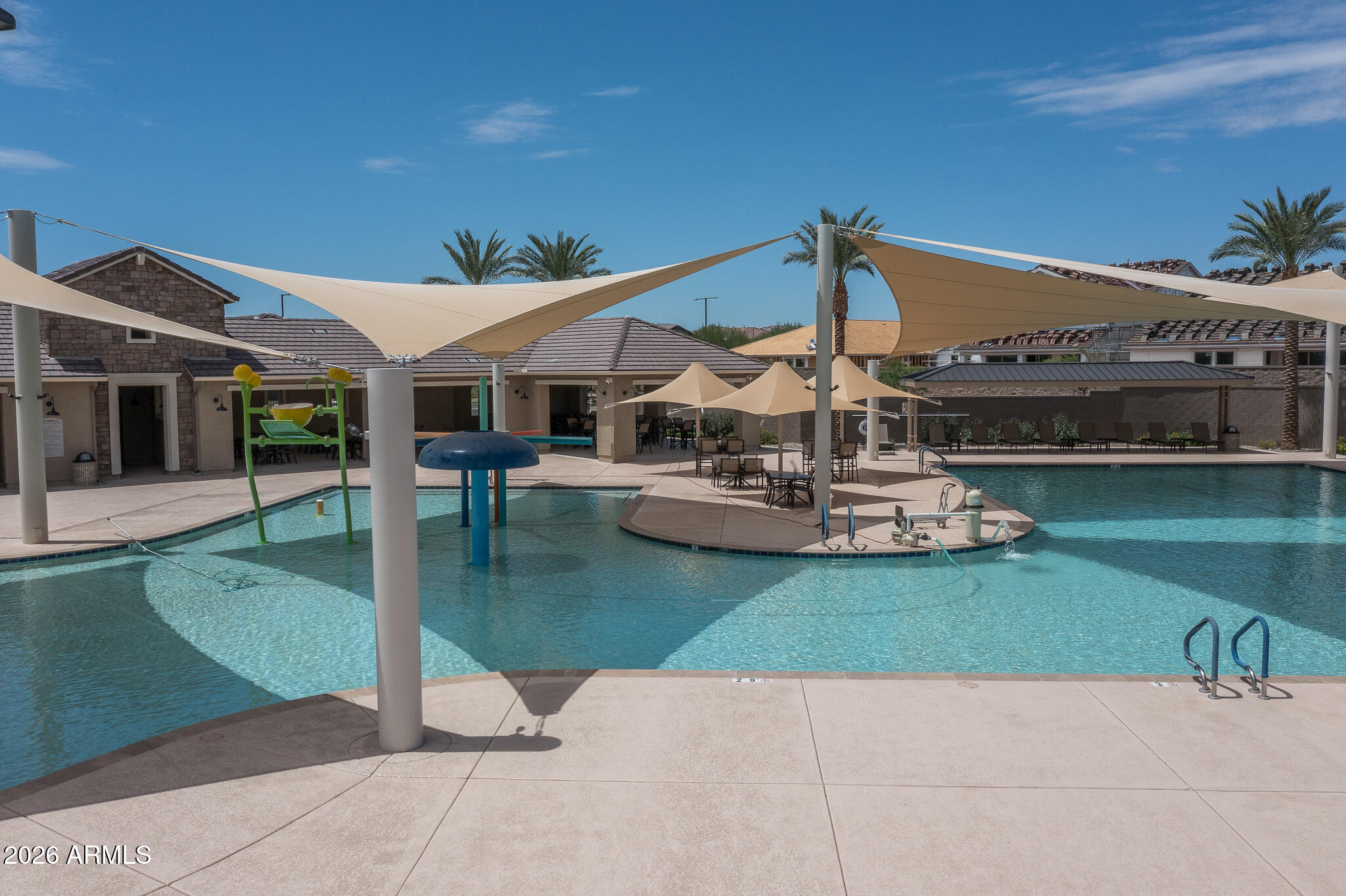 15767 West Sand Hills Road Surprise, AZ 85387 - Photo 27 of 45 a view of a patio with a table and chairs