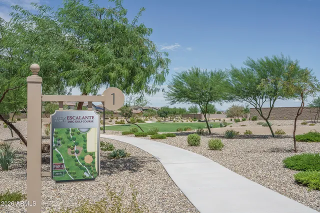 an outdoor space with patio and white umbrellas