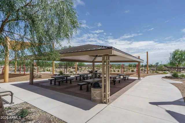 a view of a swimming pool and outdoor seating