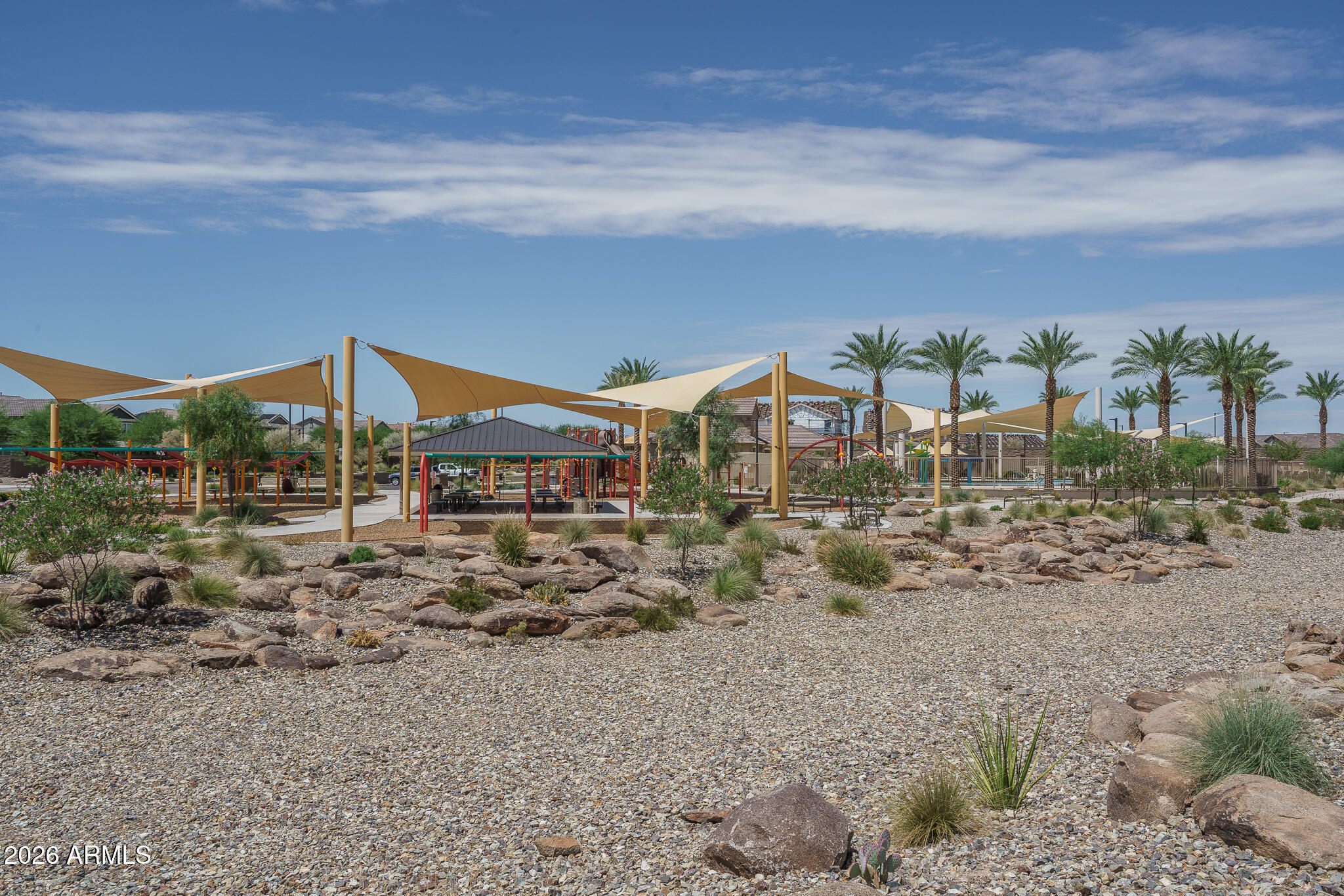 15767 West Sand Hills Road Surprise, AZ 85387 - Photo 39 of 45 a view of a houses with a yard