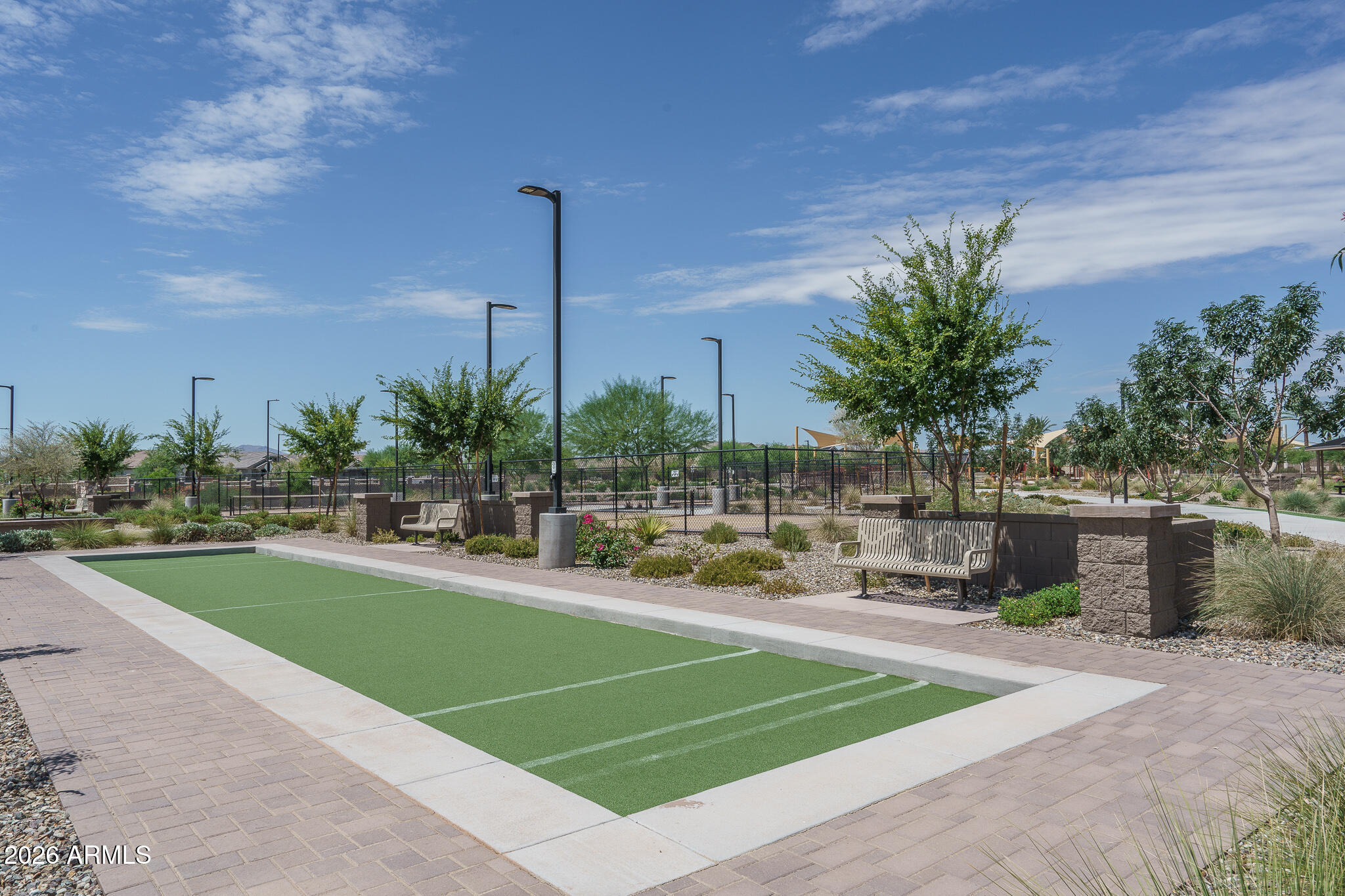 15767 West Sand Hills Road Surprise, AZ 85387 - Photo 45 of 45 a view of a swimming pool with a lawn chairs and a fire pit