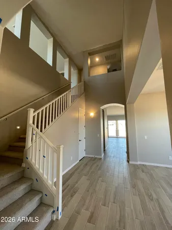 a view of an entryway with wooden floor