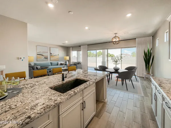 a kitchen with stainless steel appliances granite countertop sink stove and wooden cabinets