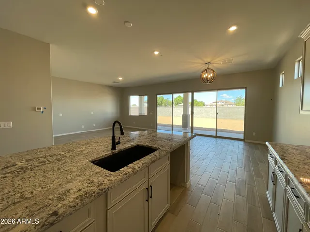 a kitchen with sink and cabinets