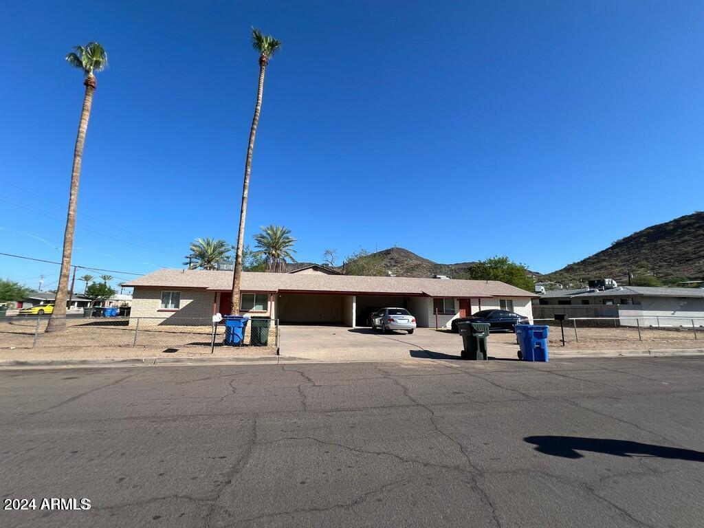 10641 North 15th Avenue, Unit B Phoenix, AZ 85029 - Photo 1 of 7 a view of street with tall buildings