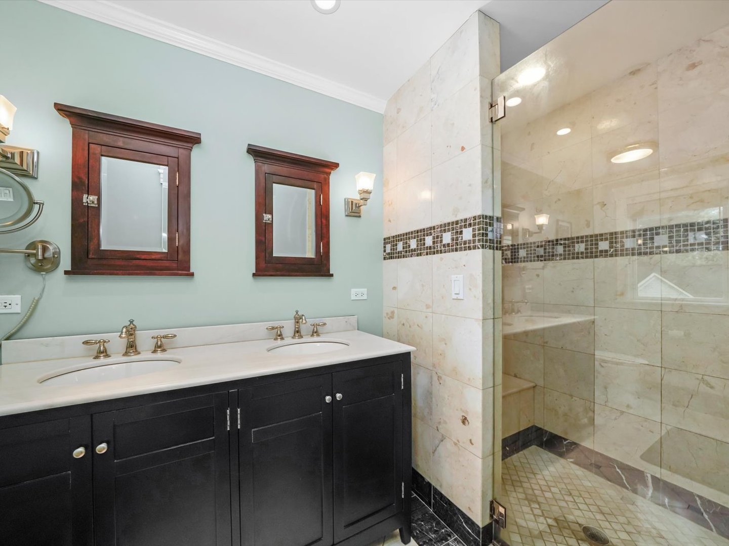 140 Lawton Road Riverside, IL 60546 - Photo 16 of 25 a bathroom with a double vanity sink a mirror and shower