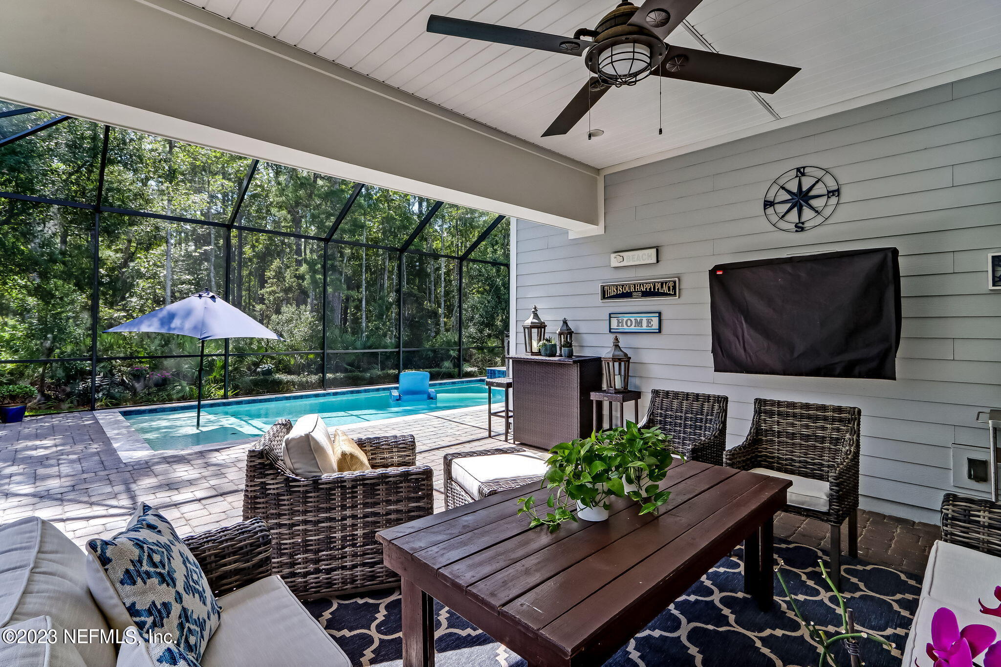 a outdoor space with patio lots of furniture and white umbrellas