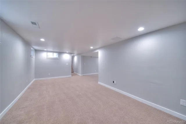 a bathroom with a toilet sink and shower