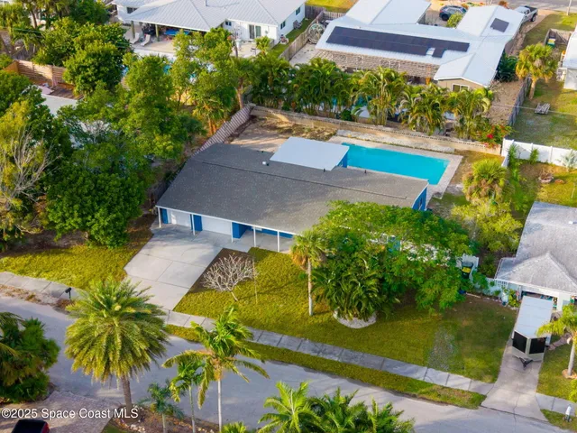 an aerial view of a house with a garden
