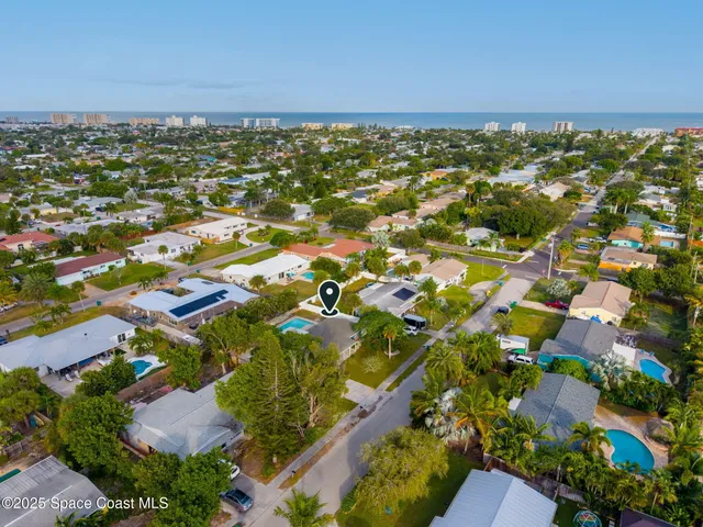 an aerial view of residential building and lake