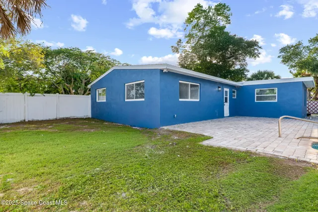 a house view with a backyard space