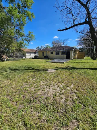 a view of a big house with a big yard