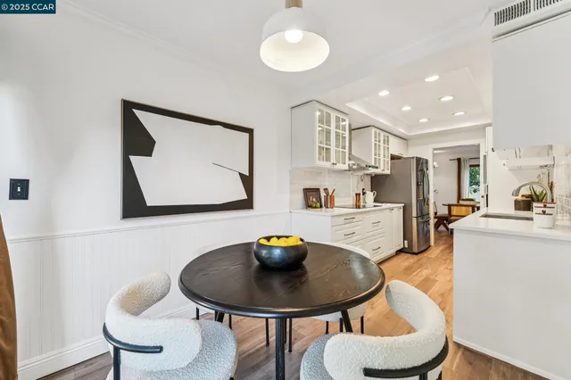 a dining room with furniture and wooden floor