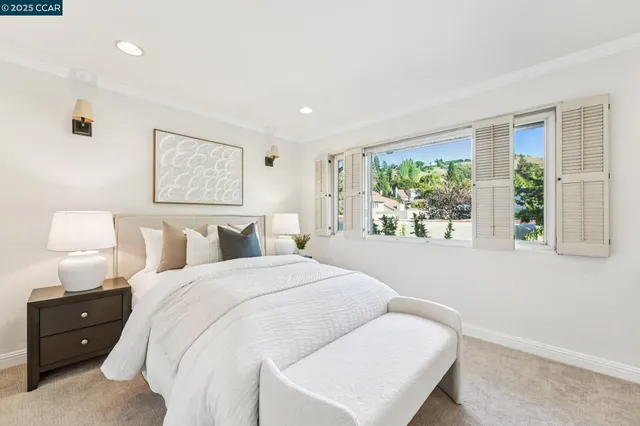 a bed room with a bed and a window