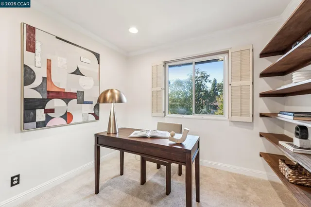 a view of a workspace with furniture