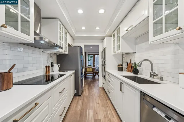 a kitchen with a sink and a refrigerator