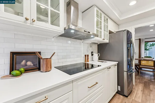 a kitchen with a sink and a refrigerator