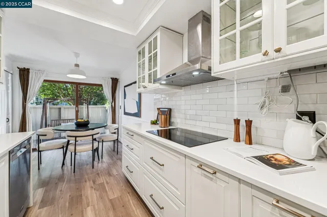 a kitchen with a sink a counter and appliances