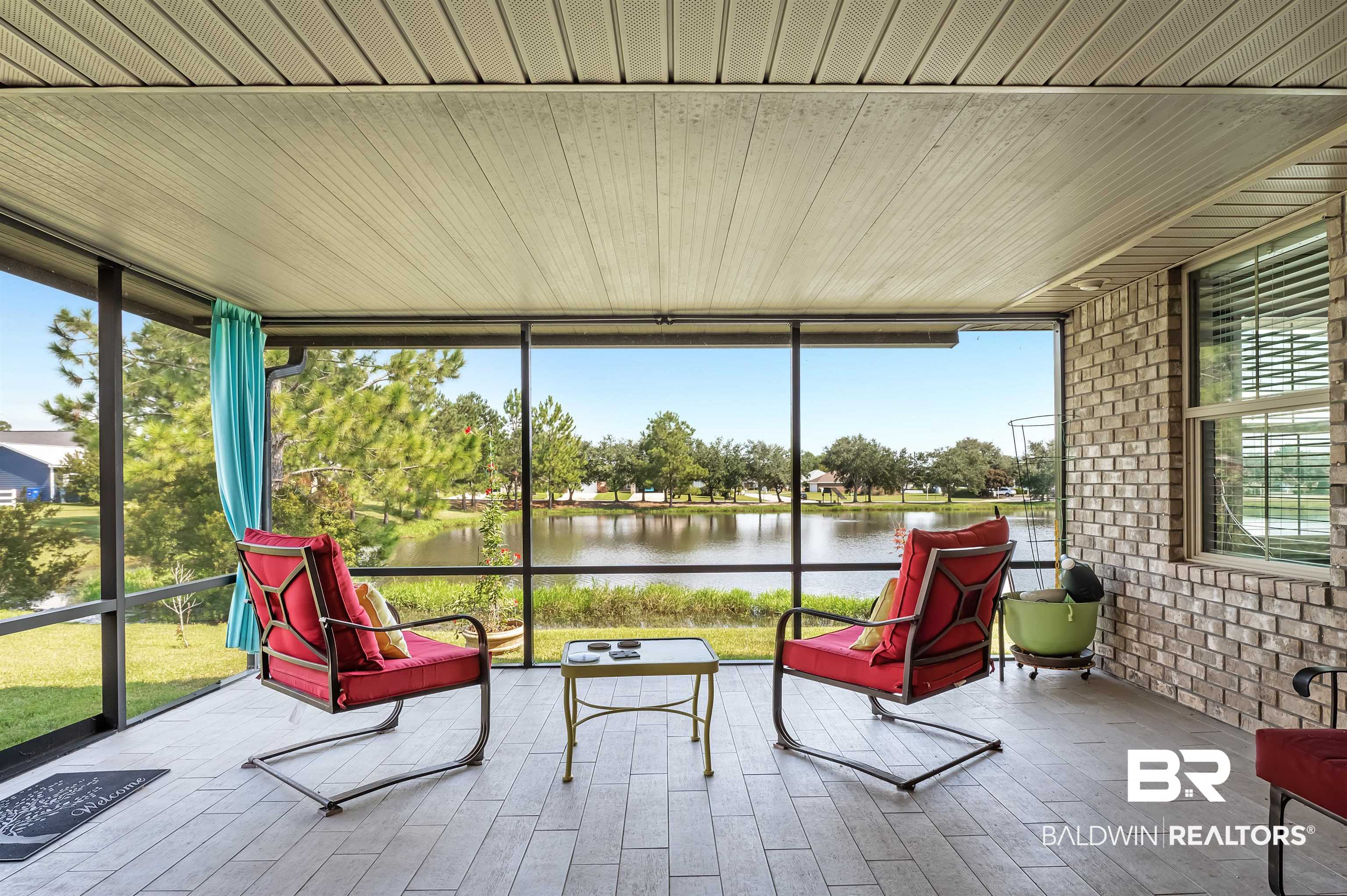 8896 Allay Lane Foley, AL 36535 - Photo 55 of 57 Sunroom featuring a healthy amount of sunlight and a water view