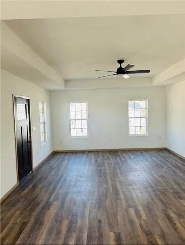 a kitchen with sink cabinets and wooden floor
