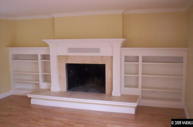 13880 Rancheros Drive Reno, NV 89521 - Photo 5 of 6 a room with a fireplace and wooden floor