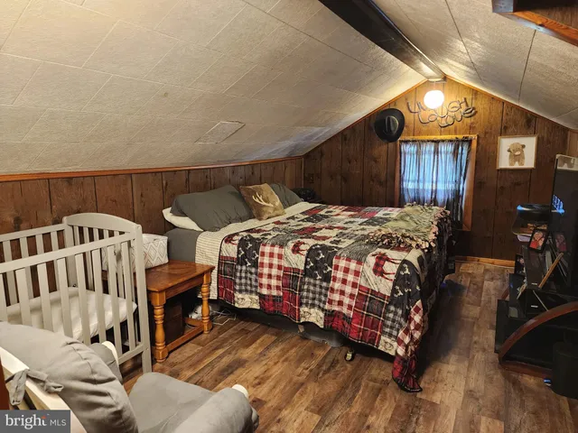 a bedroom with a bed and walk in closet