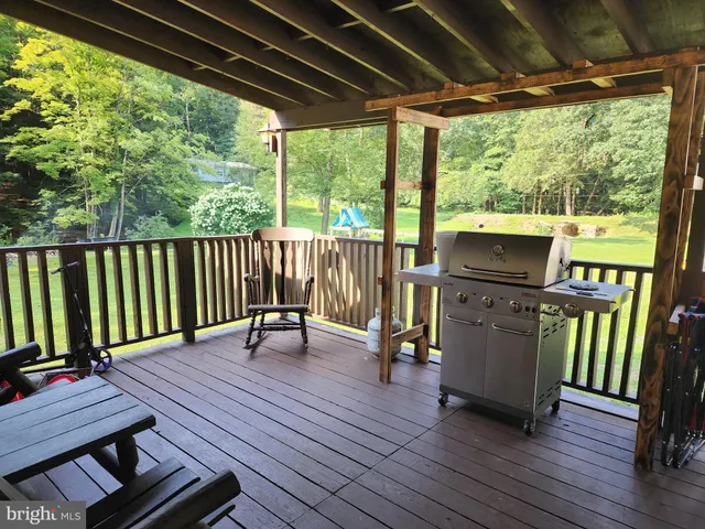 a view of a two chairs in the balcony