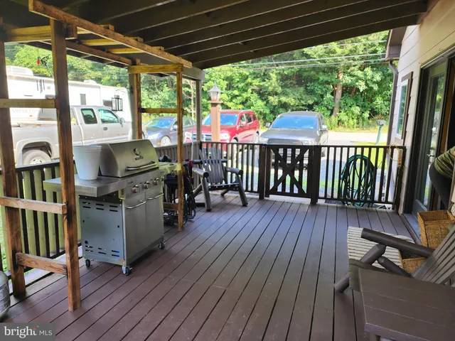 a deck view with a seating space and a floor to ceiling window