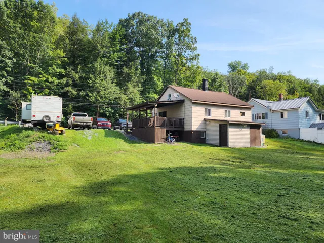 a swimming pool with lots of trees and plants