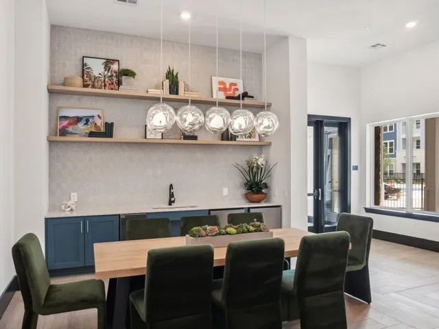 a dining room with furniture and window