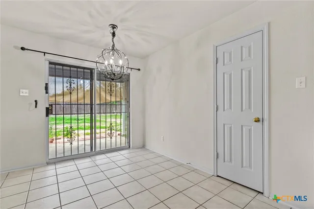 a very nice looking empty room with a window