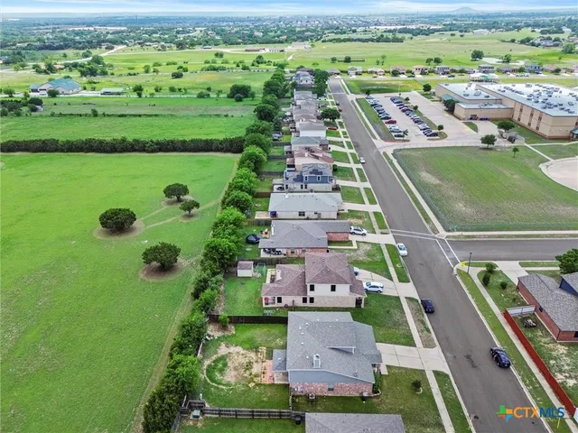 an aerial view of a house with a garden