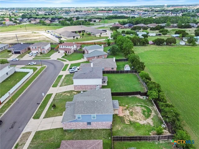 an aerial view of a house with a garden