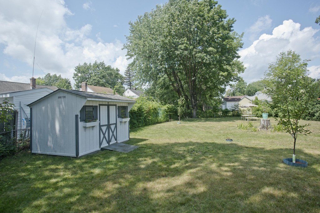 32 Rathbun Street Springfield, MA 01104 - Photo 24 of 26 a backyard of a house with lots of green space