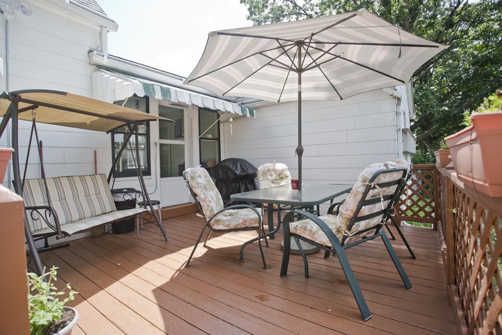 32 Rathbun Street Springfield, MA 01104 - Photo 5 of 26 a patio with table and chairs