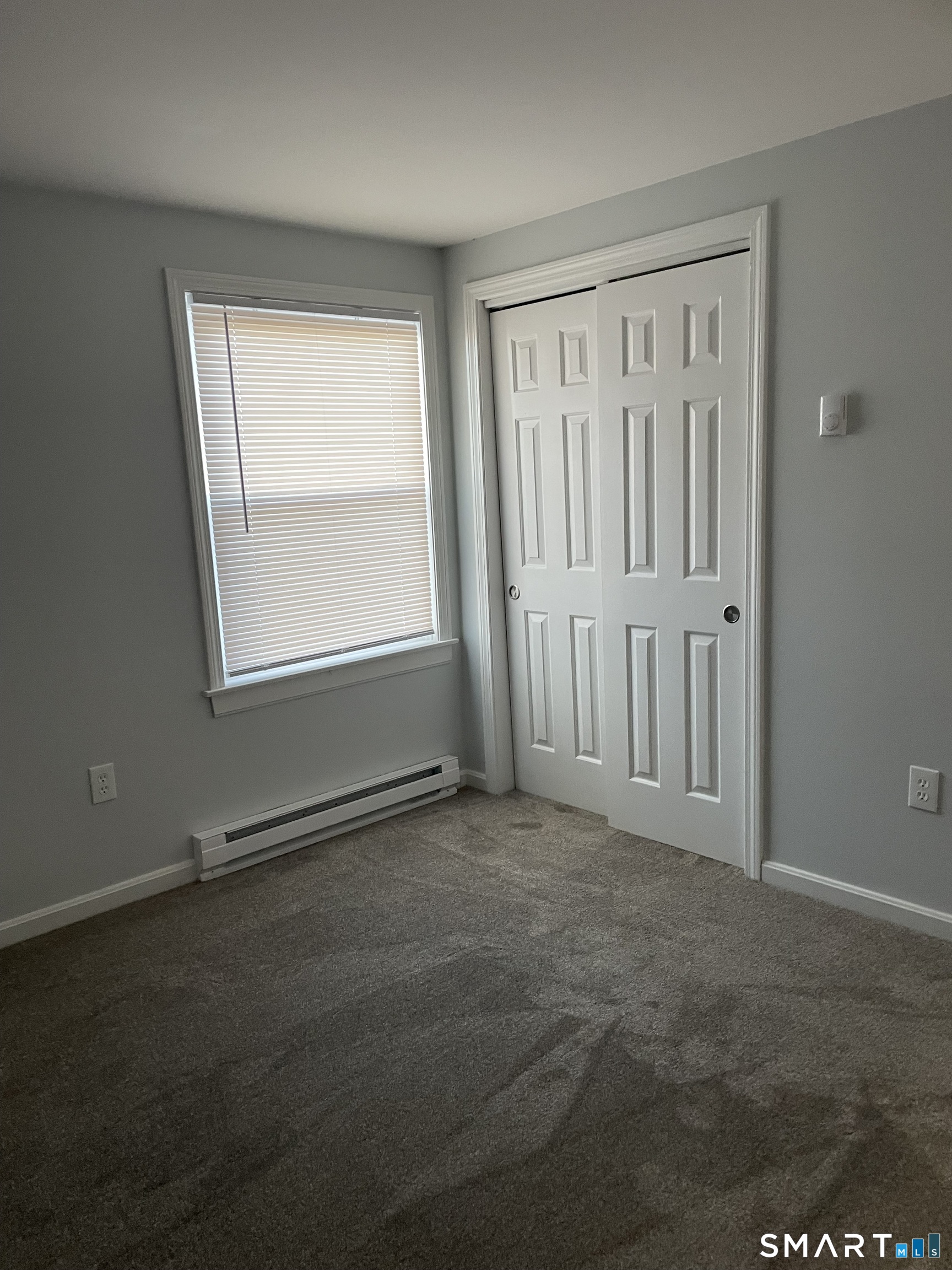 64 Deshon Street New London, CT 06320 - Photo 8 of 8 an empty room with windows