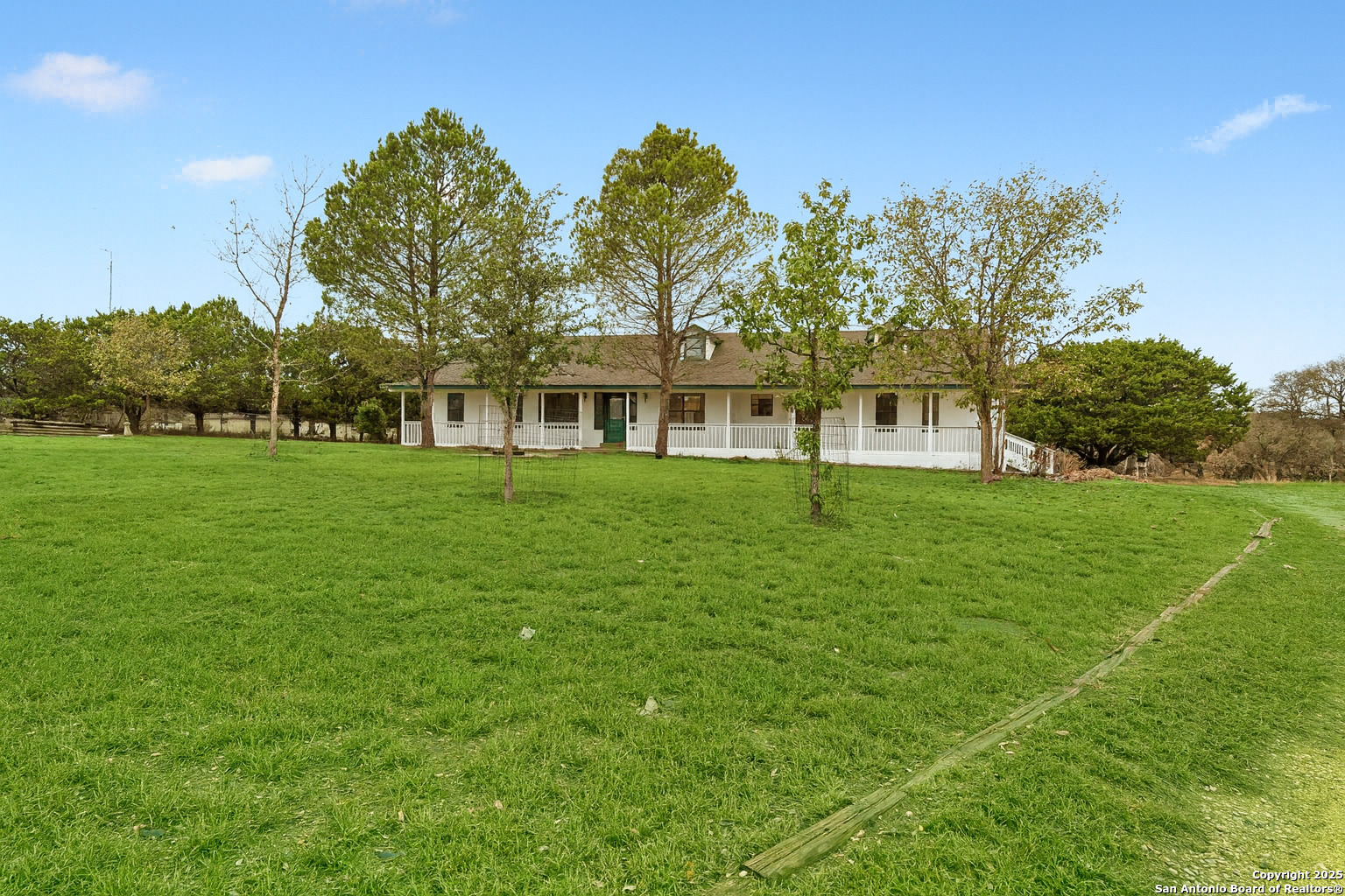 247 Center Point Drive East Center Point, TX 78010 - Photo 2 of 87 a front view of a house with a yard