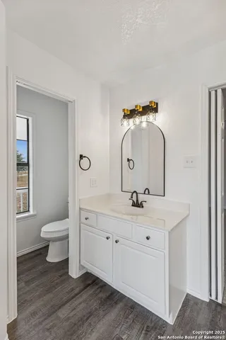 a bathroom with a glass shower door