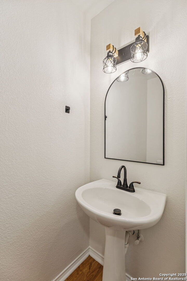247 Center Point Drive East Center Point, TX 78010 - Photo 34 of 87 a bathroom with a sink and a mirror