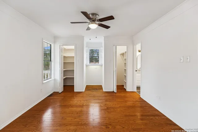 a kitchen with white cabinets and a sink