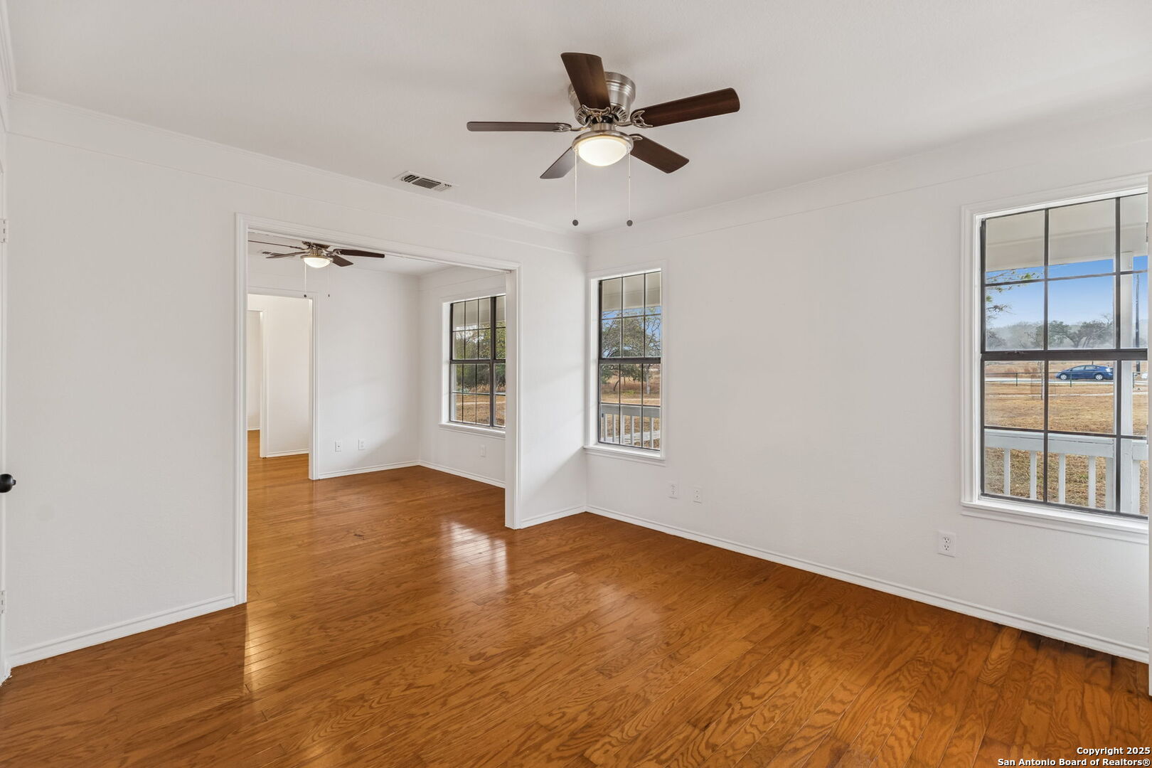 247 Center Point Drive East Center Point, TX 78010 - Photo 42 of 87 a view of an empty room with window and wooden floor