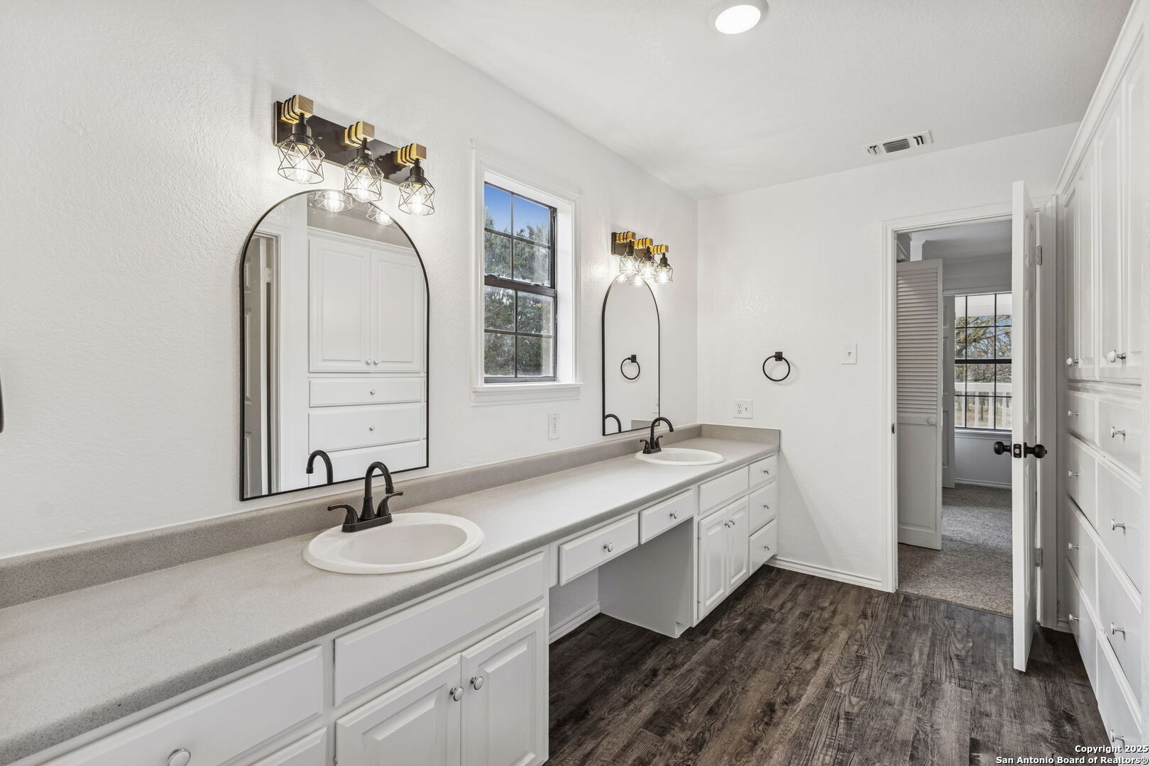 247 Center Point Drive East Center Point, TX 78010 - Photo 45 of 87 a bathroom with a double vanity sink and a mirror