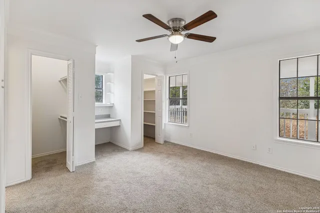 a view of a storage room with water heater and racks