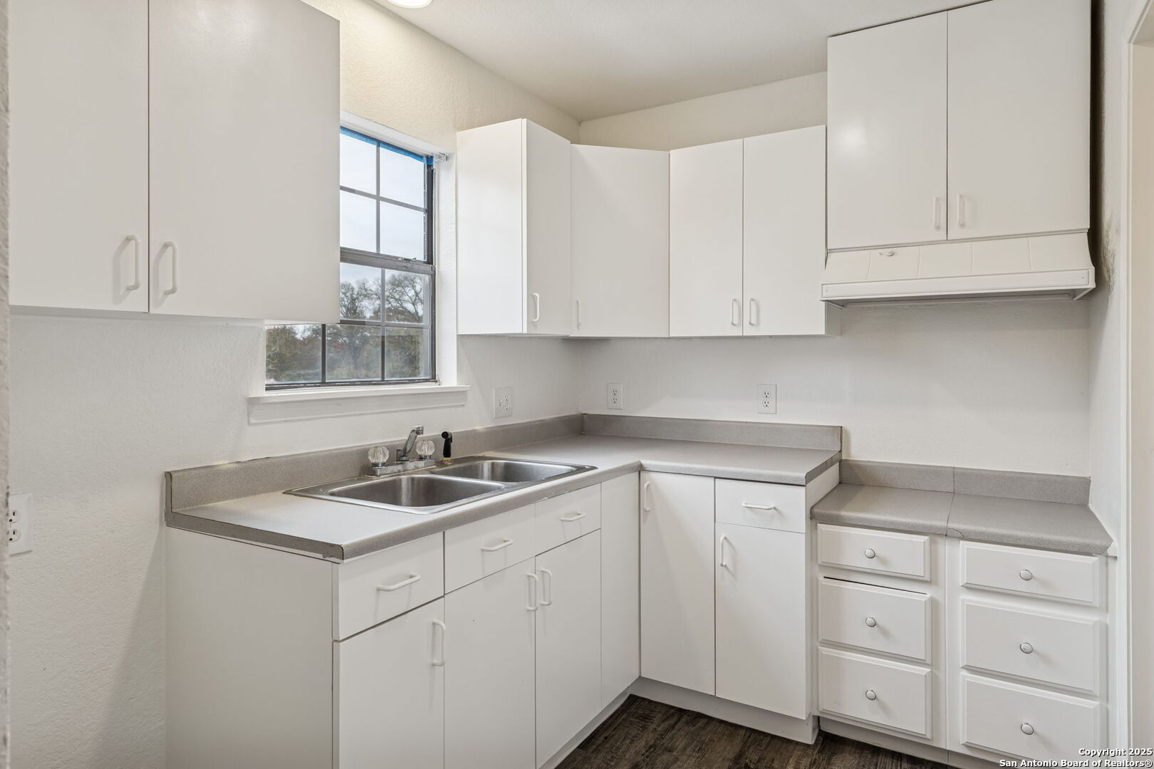 247 Center Point Drive East Center Point, TX 78010 - Photo 60 of 87 a kitchen with white cabinets and a sink